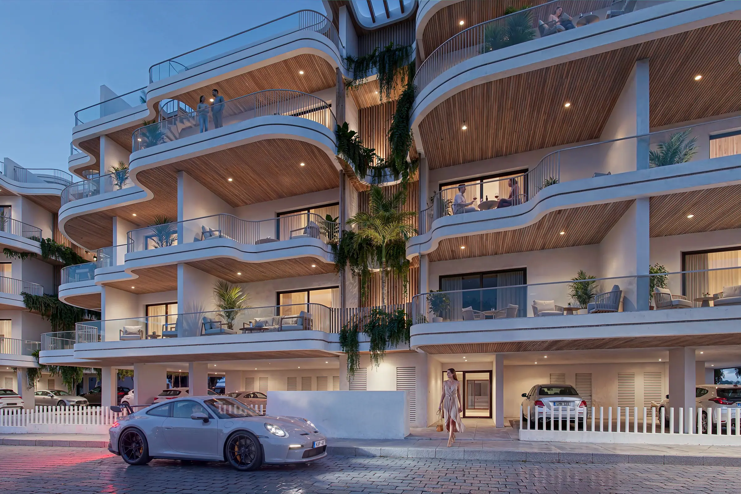 Evening view of the sculpted white facade